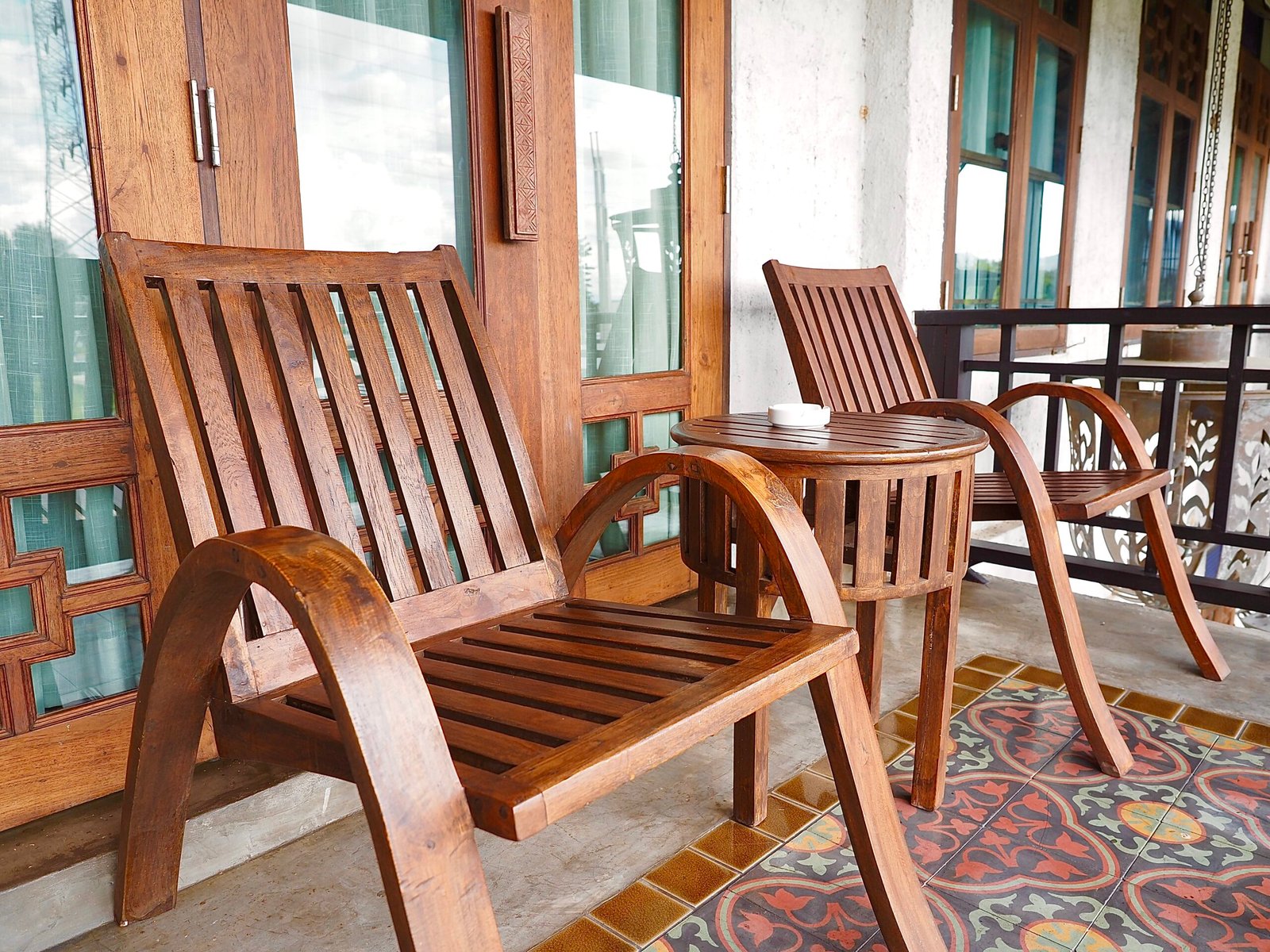 Spacious deluxe balcony room at The Balcony Chiang Mai, featuring a beautiful pool view and modern, comfortable furnishings for a relaxing stay